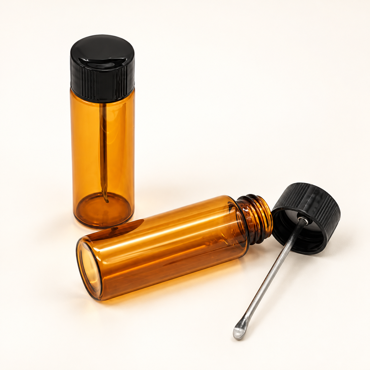 Amber snuff vials with attached spoons